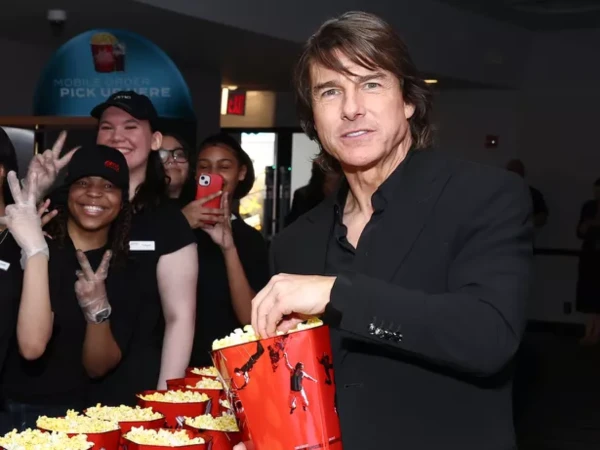 Tom Cruise eating popcorn