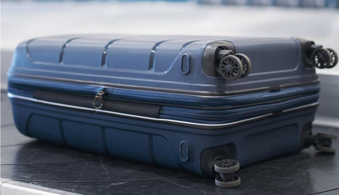 Two-year-old girl found alive in woman's suitcase