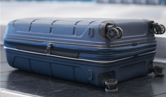 Two-year-old girl found alive in woman's suitcase