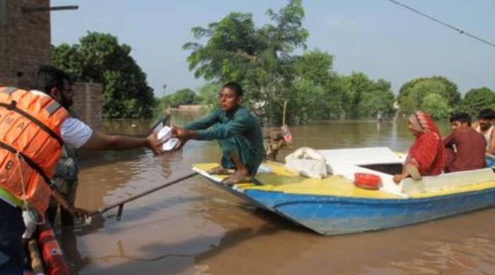 Flood victims' boat carrying food for their families capsizes