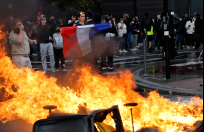 Protests against budget cuts in France; protesters set fires at several locations