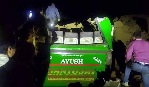 Passenger bus hit by landslide