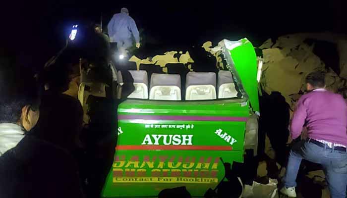 Passenger bus hit by landslide