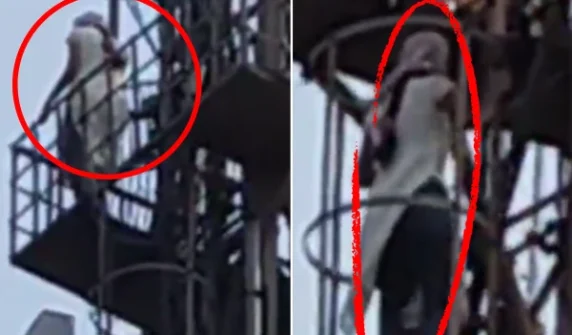 Young girl climbs mobile tower
