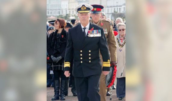 fake admiral and laid flowers at the soldiers' memorial.