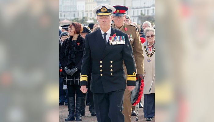 fake admiral and laid flowers at the soldiers' memorial.