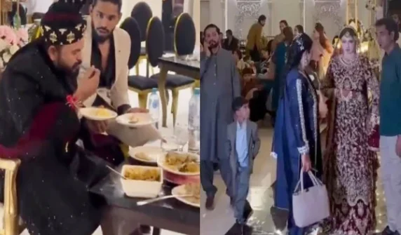 the groom is also busy eating when the bride enters.