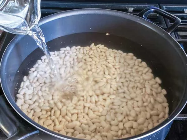 Is it necessary to soak beans in water before cooking?