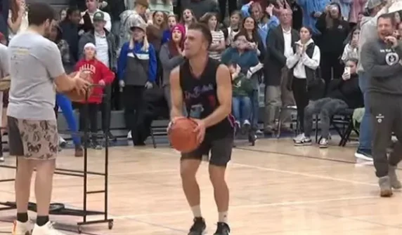 Gym teacher sets Guinness World Record for three-pointer shots