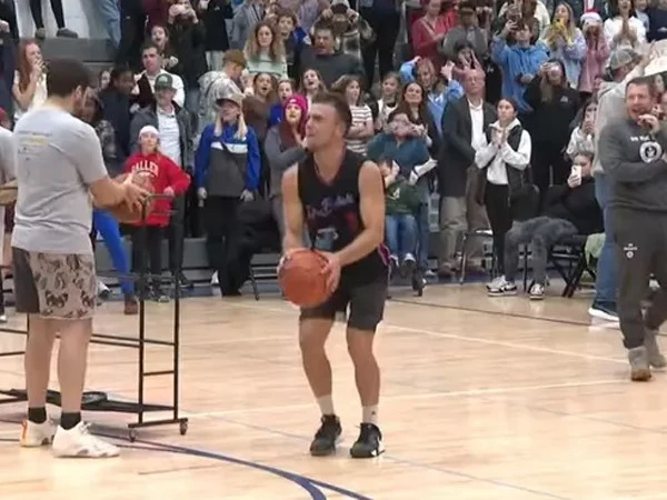 Gym teacher sets Guinness World Record for three-pointer shots