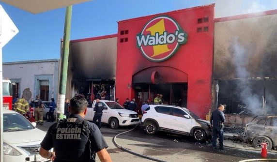 Massive fire breaks out after explosion in supermarket