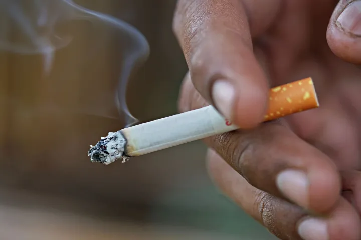 Smoker badly burned after flame falls on clothes while smoking