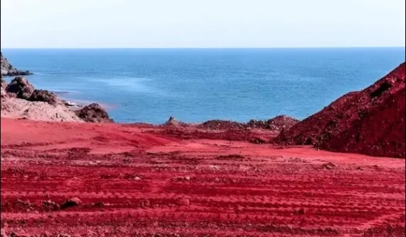 Why did Iran's coast turn "red like blood"?