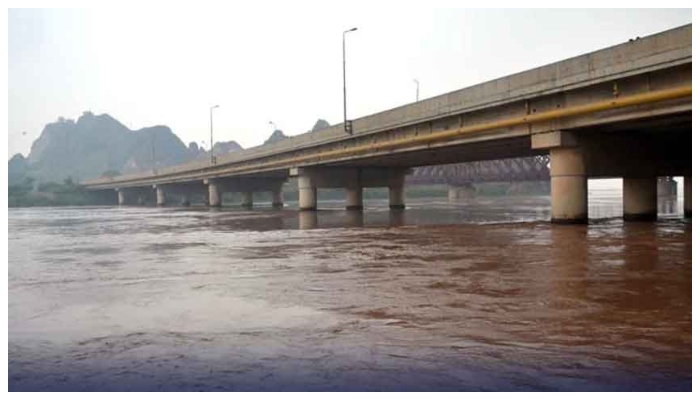 A temporary iron bridge washed away by the floodwaters