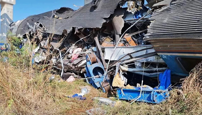 Passenger train hits fallen crane on track