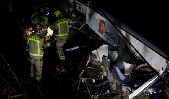 Passenger train crashes after wall collapses on track