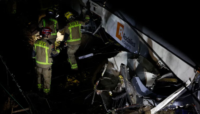 Passenger train crashes after wall collapses on track