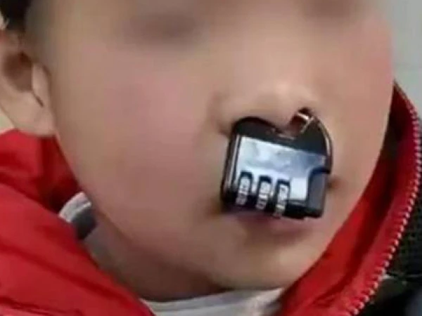 Naughty child puts a lock in his nose