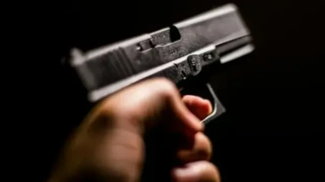 A young man was shot in the head and killed on a moving motorcycle