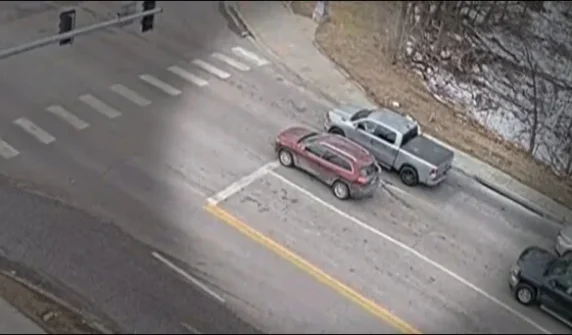 Vehicles parked at traffic lights suddenly sink into the ground