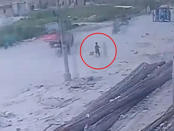 Footage of a young child falling into an open manhole has emerged