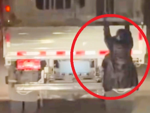Wife hangs herself from truck to catch husband red-handed