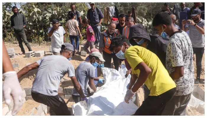Israeli occupation forces exhume buried Palestinian body and move it to another location