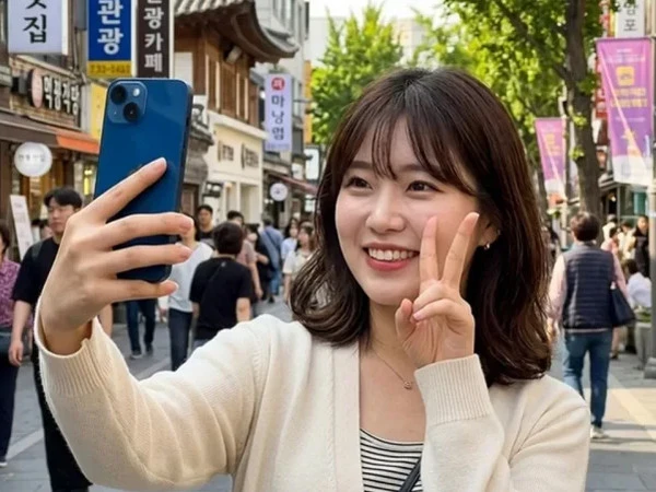 Showing the 'Victory' sign in the picture may cause trouble for you!