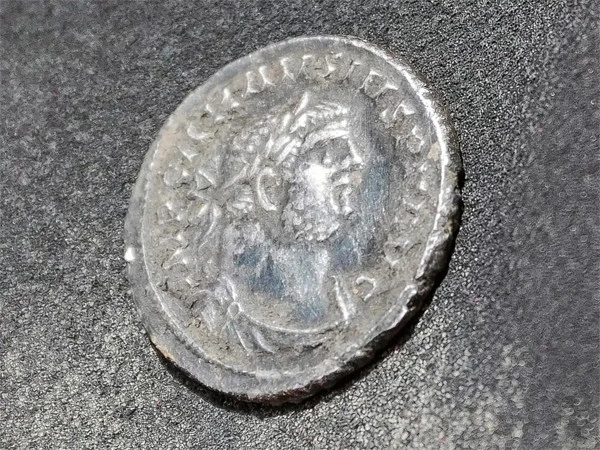Ancient Roman-era coin discovered during railway line excavation.