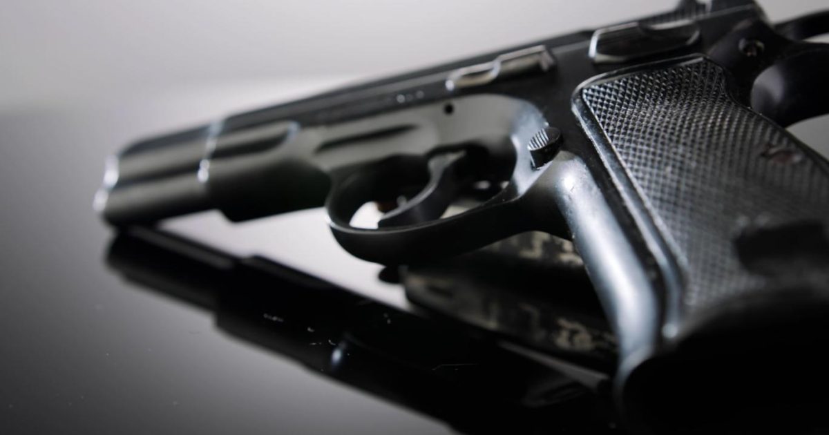 Woman dies after pistol discharges while being placed on hotel table