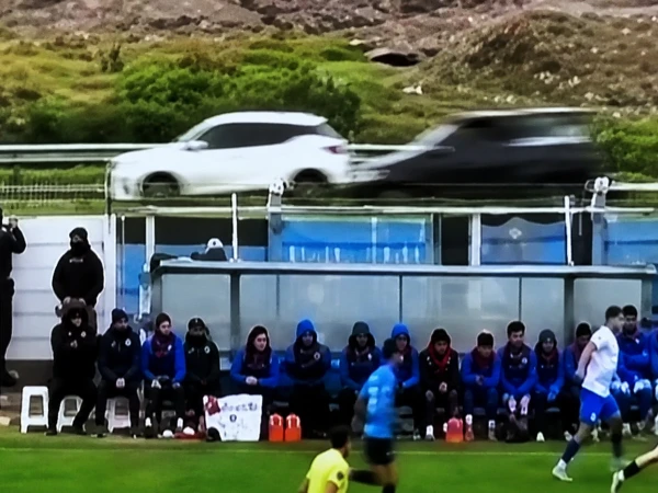 Accident caused by football rolling onto the road during a match