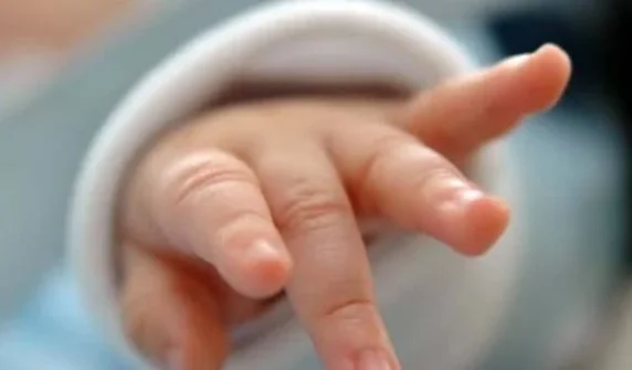 A mother allegedly killed her two-month-old baby by throwing him into a drain.