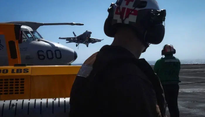 Three US aircraft carriers deployed to boost military strength near Iran.